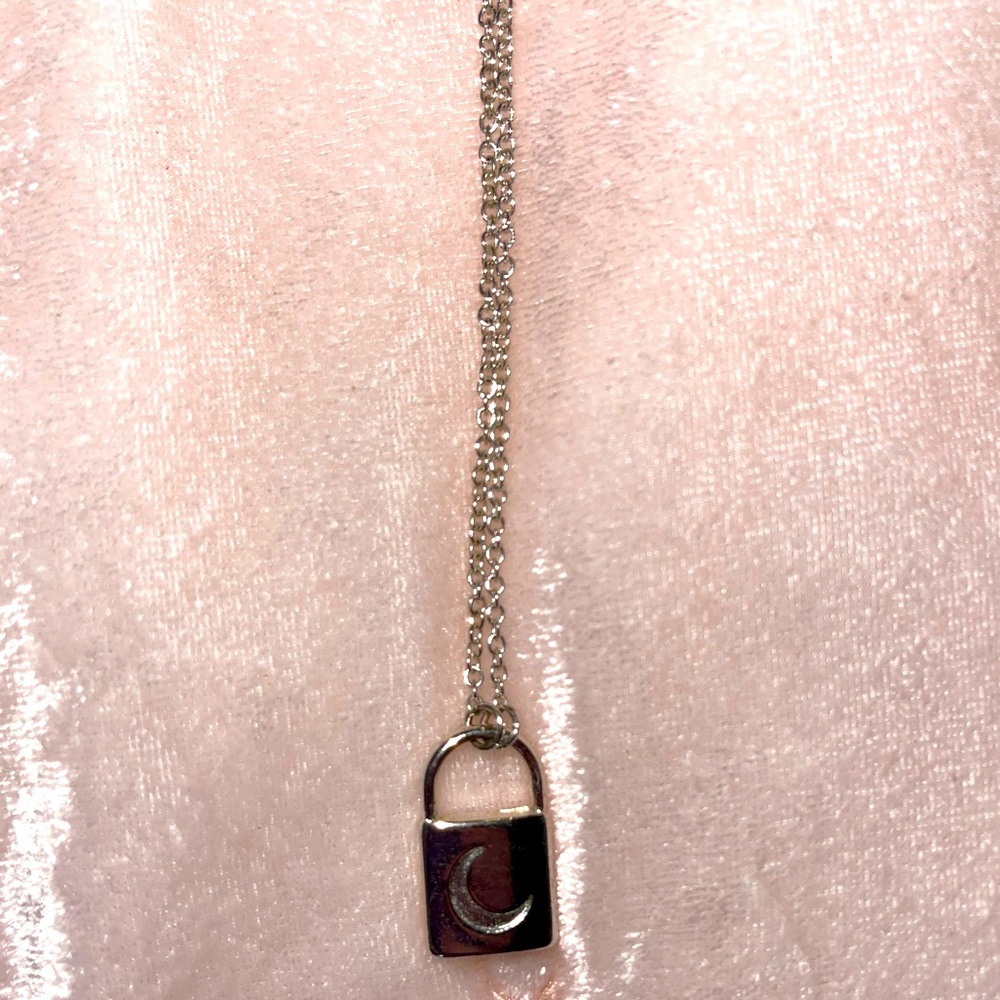 A medium length silver lock necklace